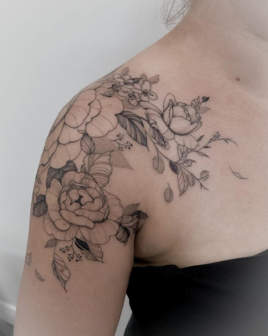 upper breast tattoo