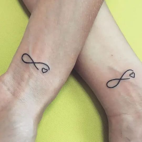 Matching infinity tattoos with wedding date  Infinity couple tattoos Infinity  tattoos Infinity symbol tattoo