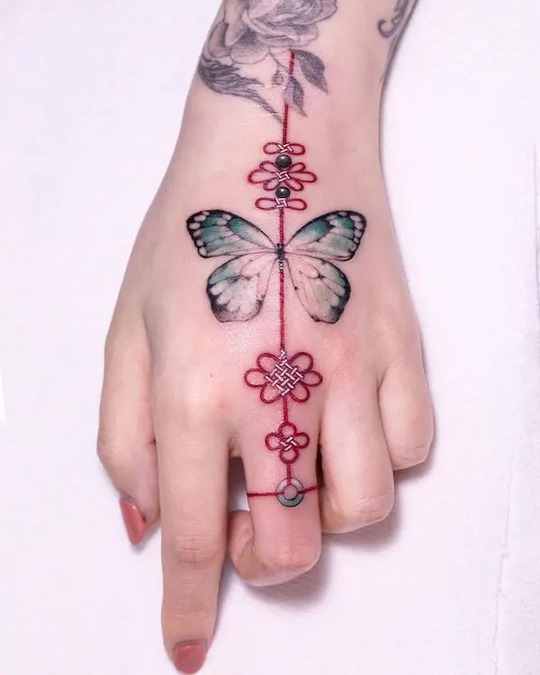Butterfly and Red Knot hand Tattoo
