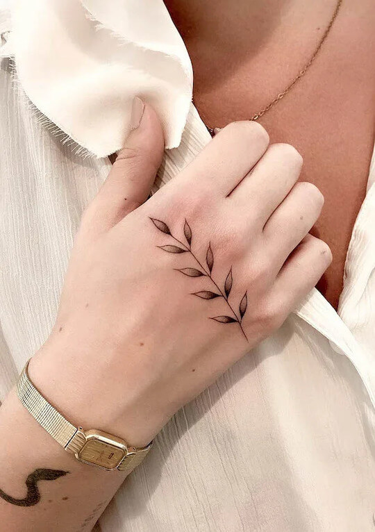 Trees and Leaves Female hand Tattoo