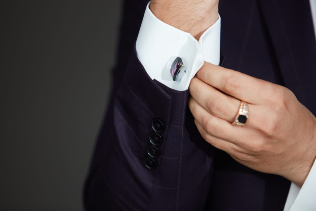 Man opening Button of his Formal Suit